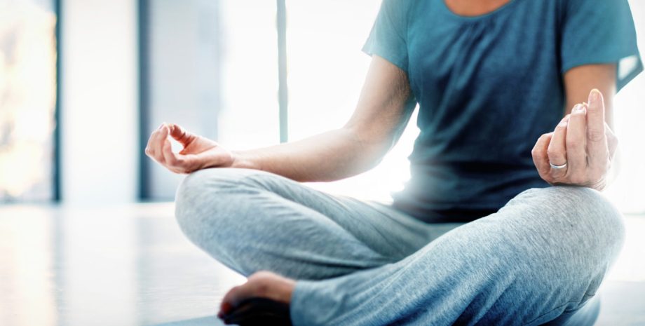 Woman practicing yoga indoors