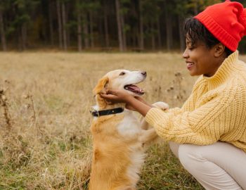 Woman and her dog in a field.